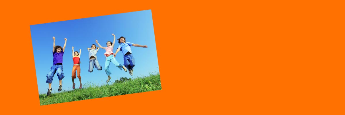 Jewelers for Children charity partners page banner showing children jumping in a field